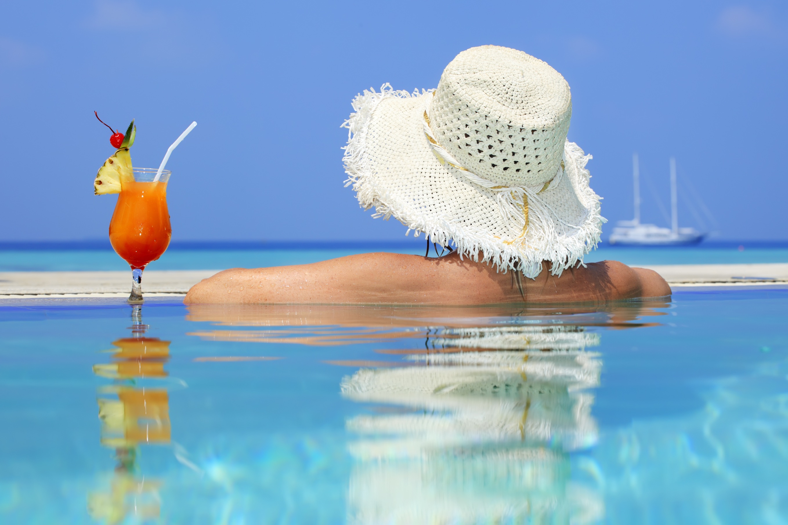 Rear view of a woman into the swimming pool.